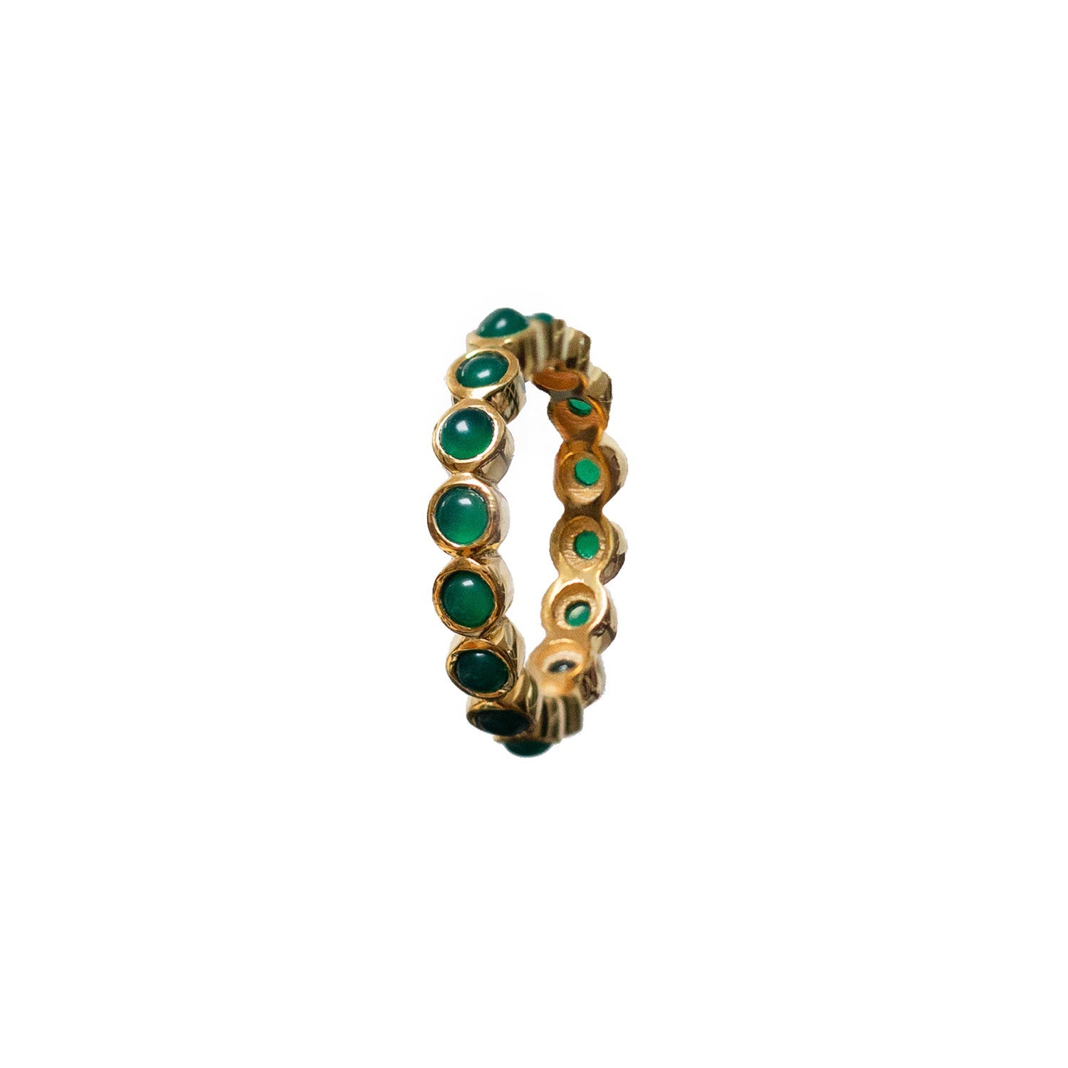 Gold ring with round green gemstone inlays in a full band design