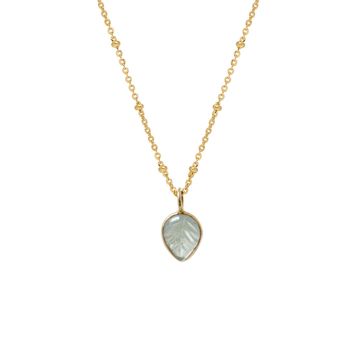 A gold-plated copper necklace featuring a carved leaf-shaped aquamarine pendant on a short satellite chain.