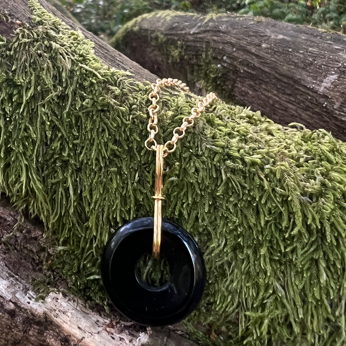 Grounding black onyx disc on short black onyx rosary or Belcher chain