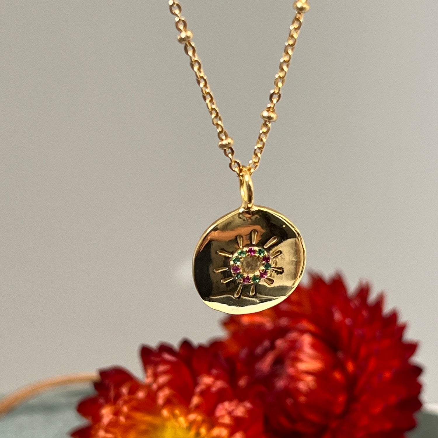 Sun Medal with Multi Coloured Zircons On Short Satellite Chain