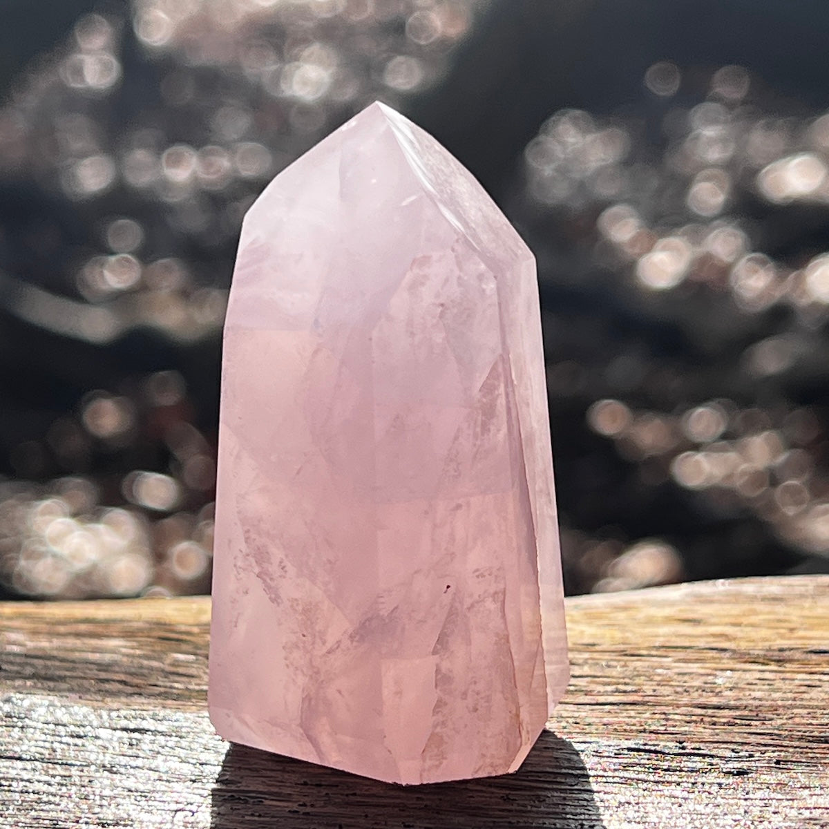 Rose quartz crystal point outside