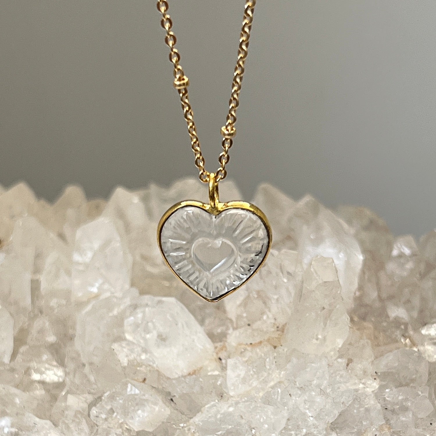 Carved rock Crystal Heart pendant on short satellite chain