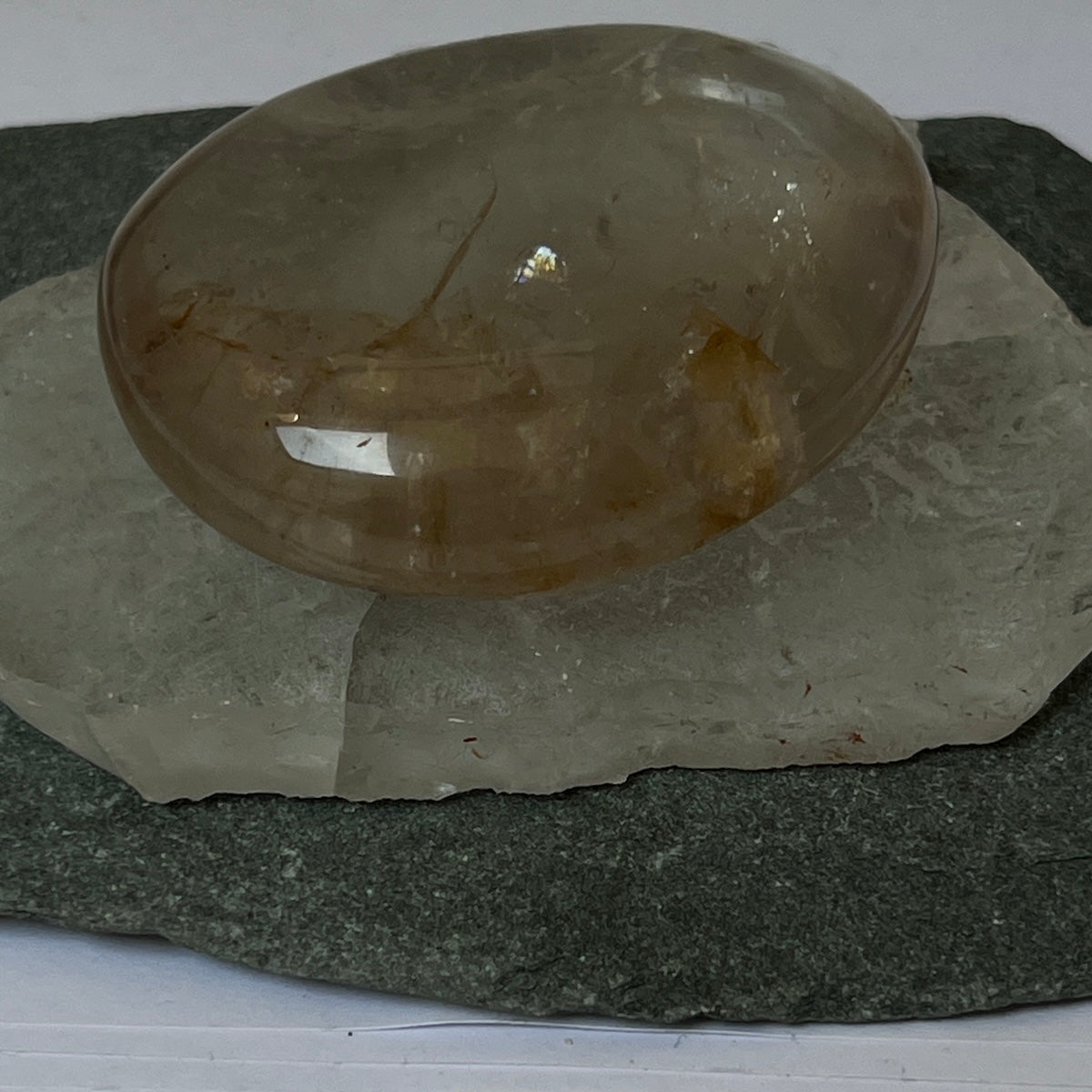 Palm stone Rock crystal with golden healer inclusions