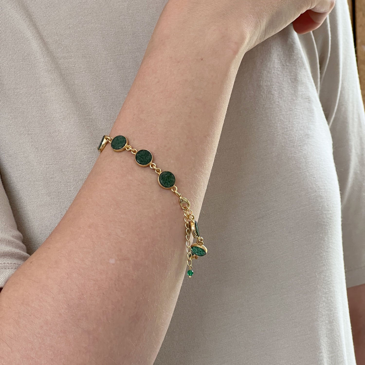Jade Confetti Gemstone 22ct Gold Plated Bracelet with extender worn on a model's arm.