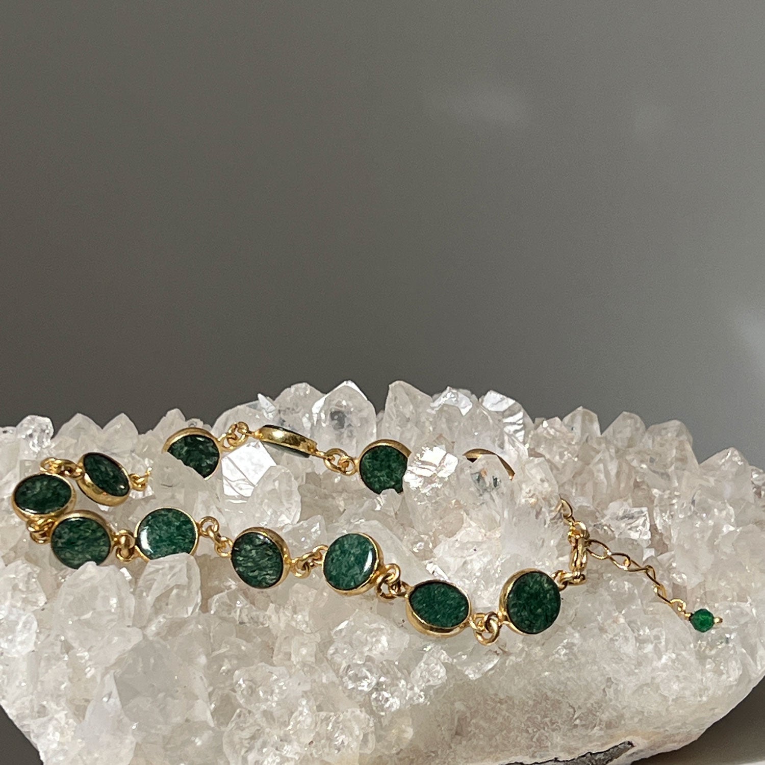 Jade Confetti Gemstone 22ct Gold Plated Bracelet on a bed of crystals