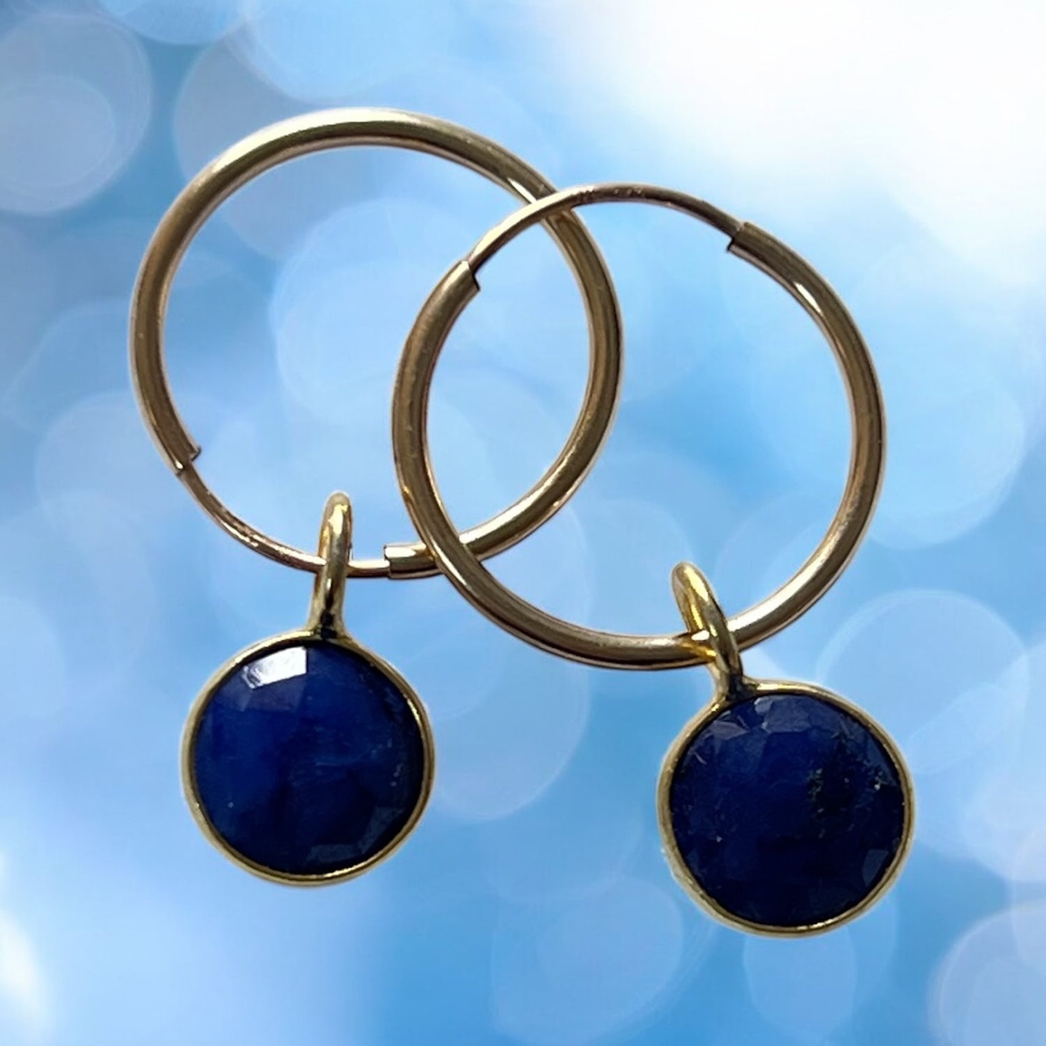 Gold Fille creole with astro sapphire