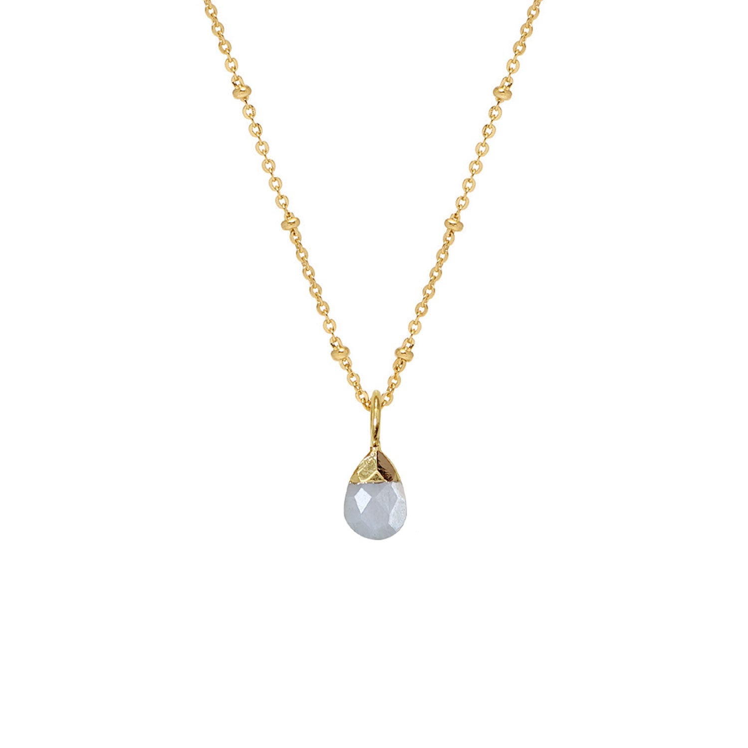 A white moonstone briolette pendant on a gold-plated brass chain with small gold-tone beads, displayed against a white background.