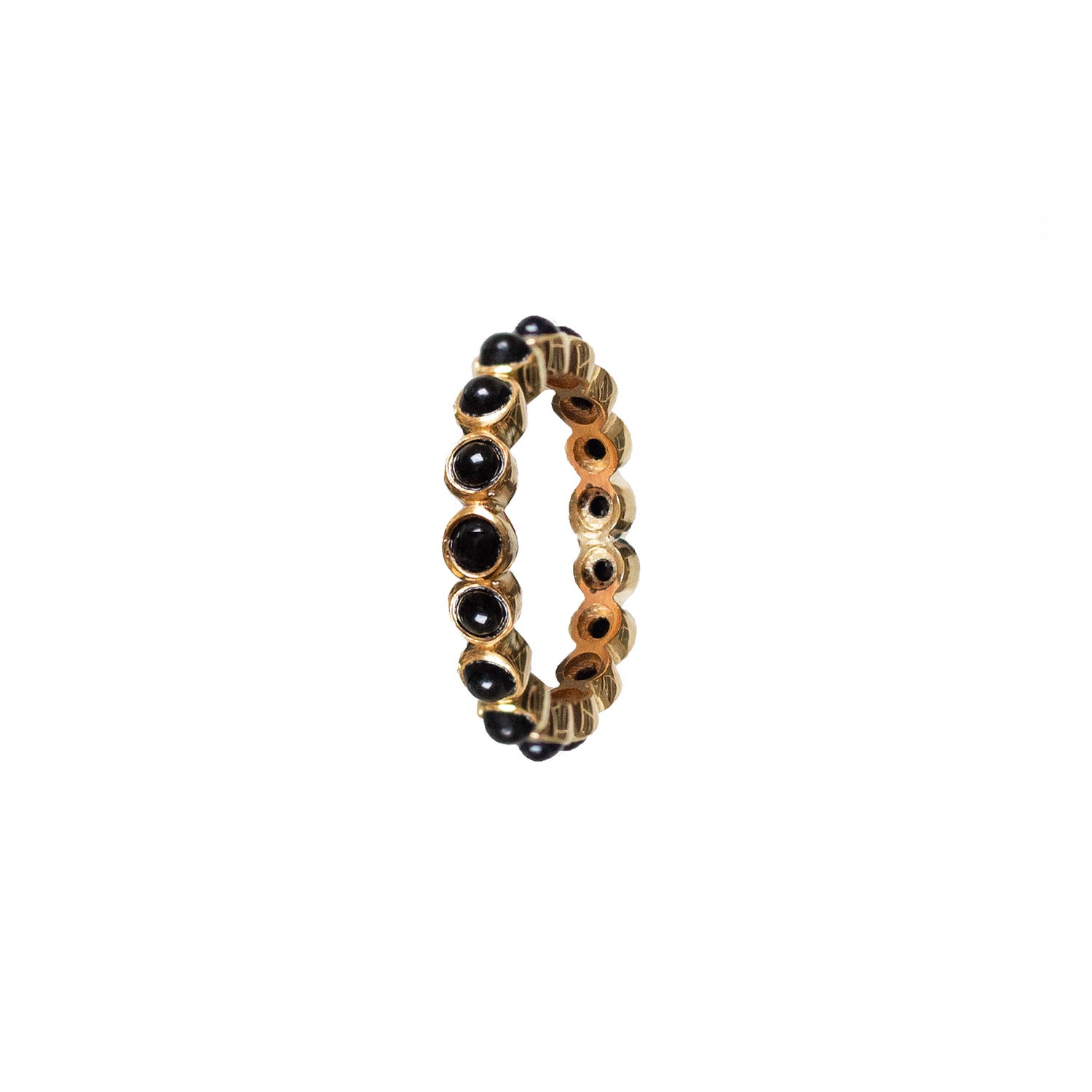 A gold-plated sterling silver ring with black onyx cabochons set around its circumference.