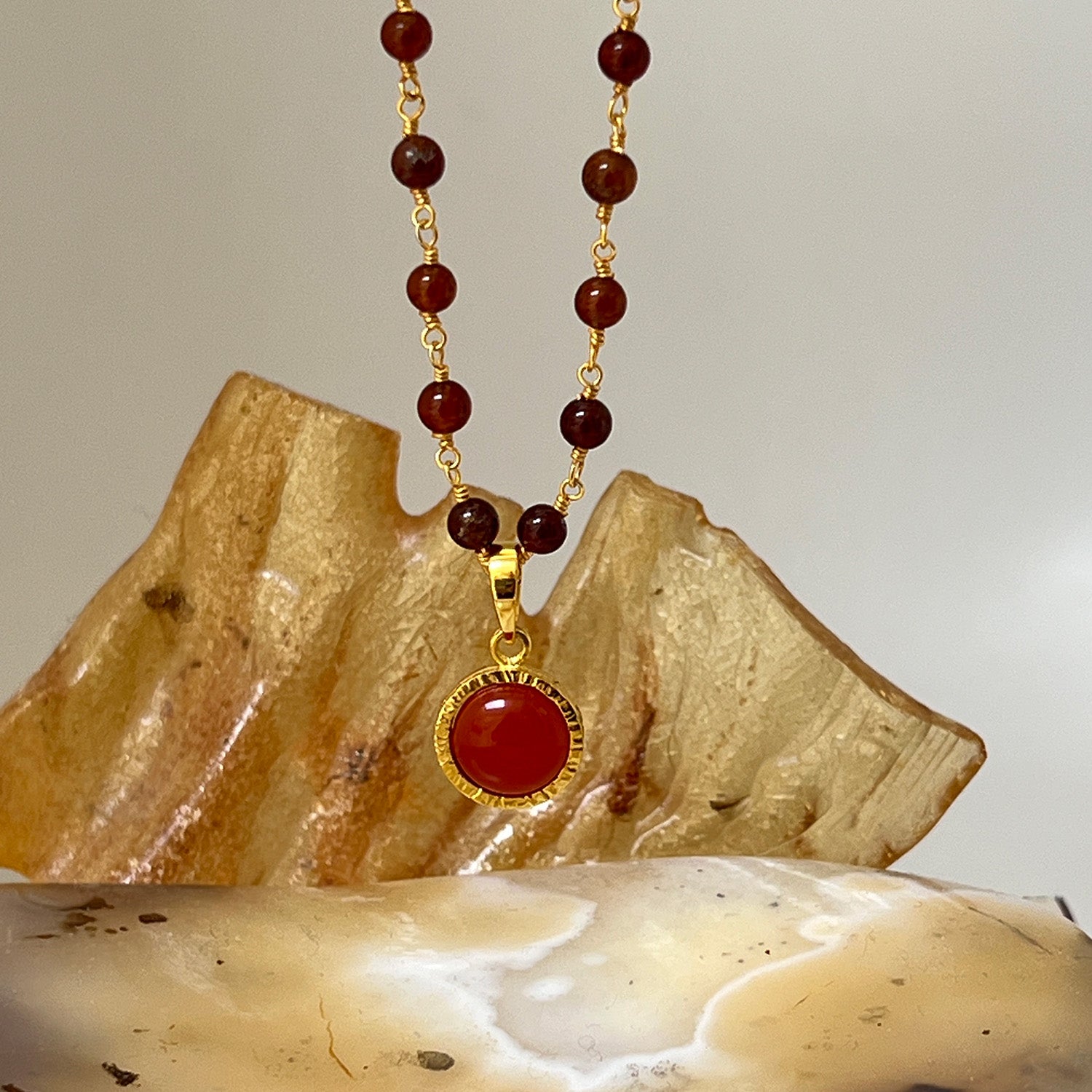 Dunia Red Onyx Round Pendant On Long Hessonite Garnet Rosary