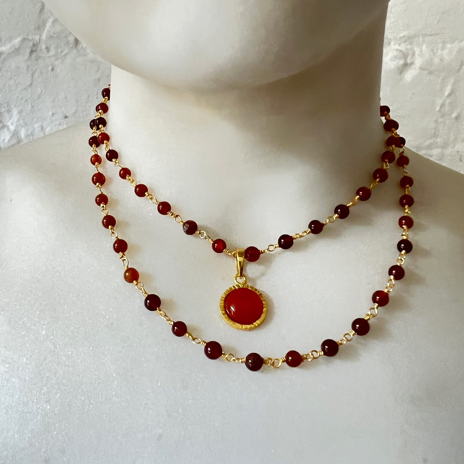 Dunia Red Onyx Round Pendant On Long Hessonite Garnet Rosary