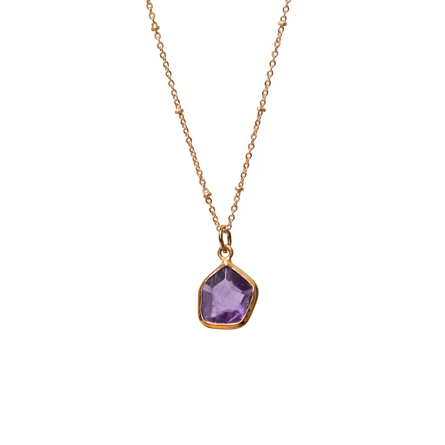 Necklace with a purple amethyst gemstone pendant on a white background