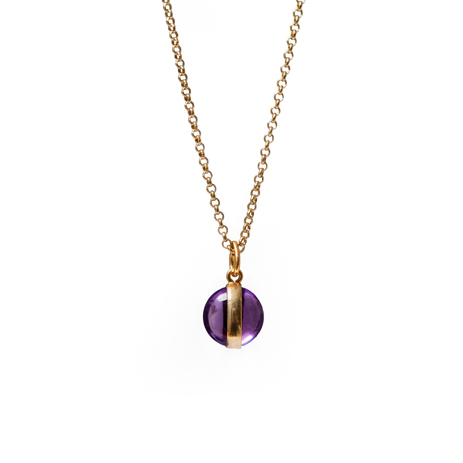 Necklace with a purple amethyst and gold pendant on a white background
