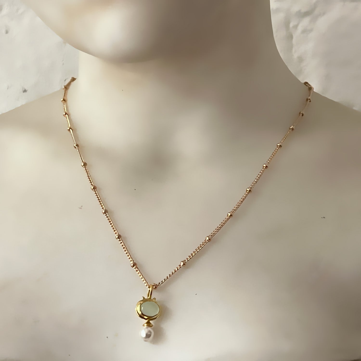Aqua Chalcedony & Pearl Pendant on a Gold Plated Biba Chain on the neck of a manequin