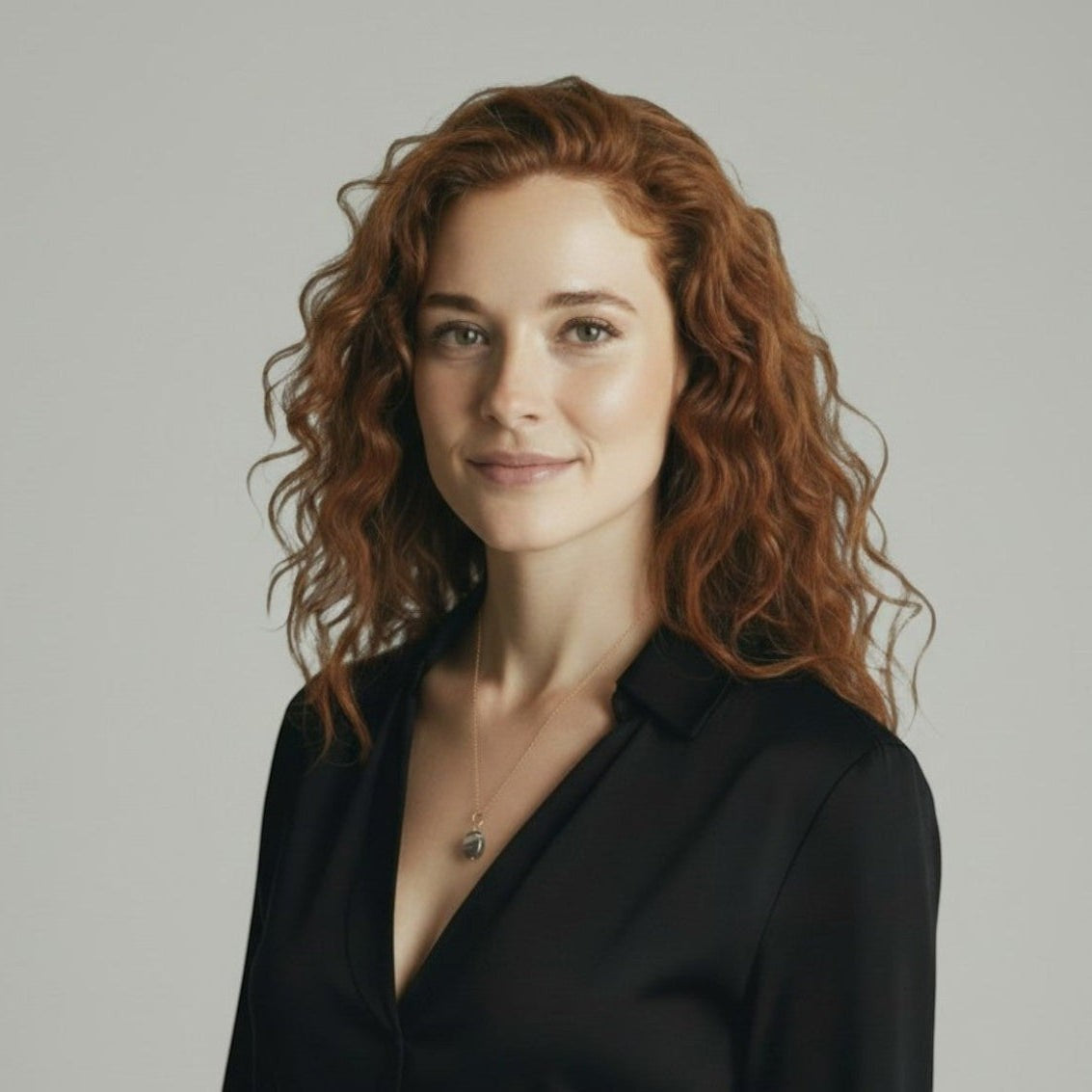 Mirabelle Jewellery small freeform Botswana agate pendant on a 45cm gold-plated brass chain with extender, worn by a woman with red curly hair.
