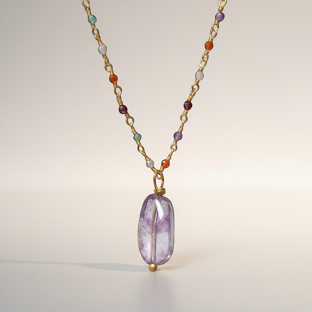 Mirabelle Jewellery gold-plated brass rosary necklace with a smooth amethyst drop and multi-coloured semi-precious stones.