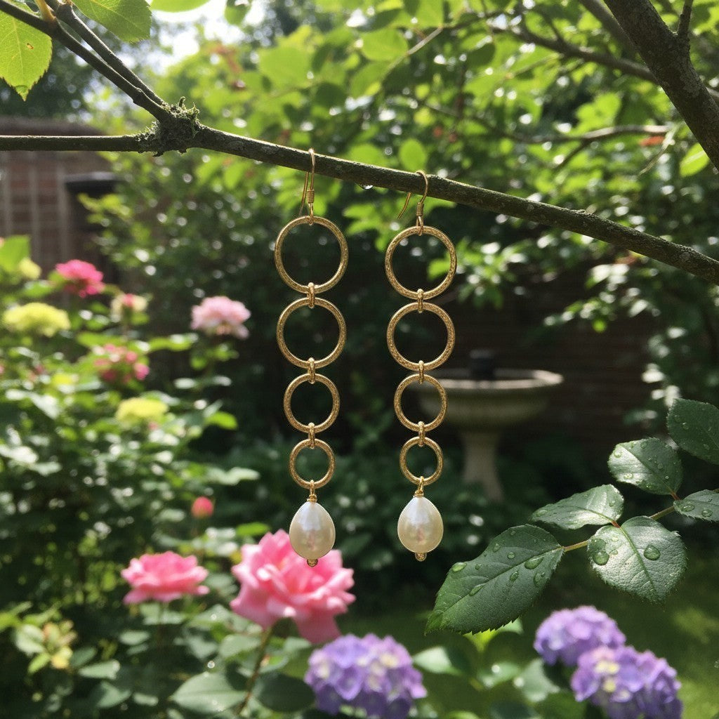 Mirabelle Jewellery gold hammered hoop and pearl drop earrings, handmade in London studio. Perfect for brides.