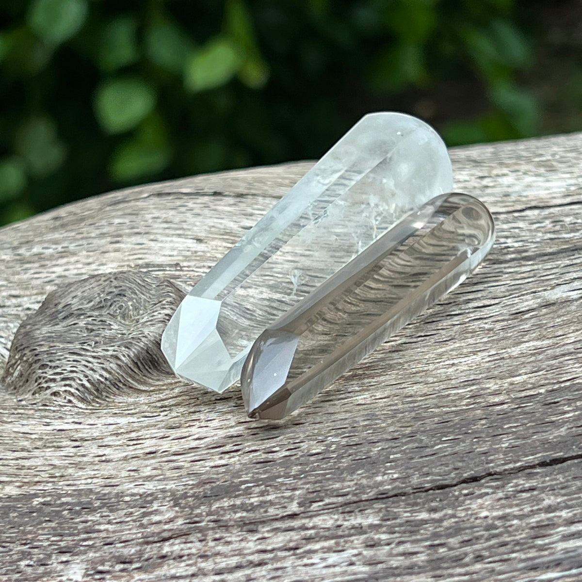 Mirabelle Jewellery crystal wands from Madagascar, featuring a clear rock crystal and a light smoky quartz point.
