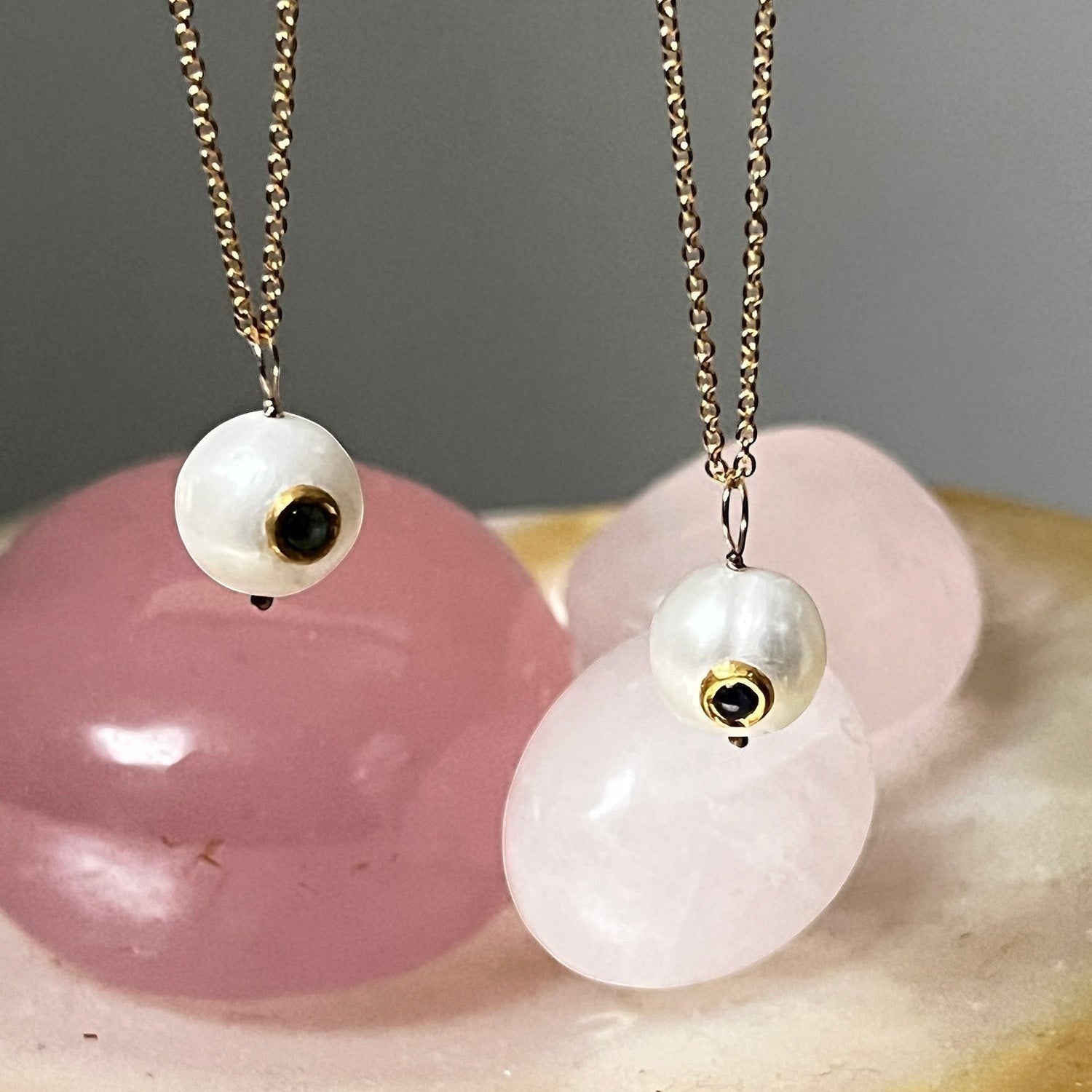 Mirabelle Jewellery round freshwater pearl pendant necklace with emerald and sapphire inlay on a 22ct gold filled chain.