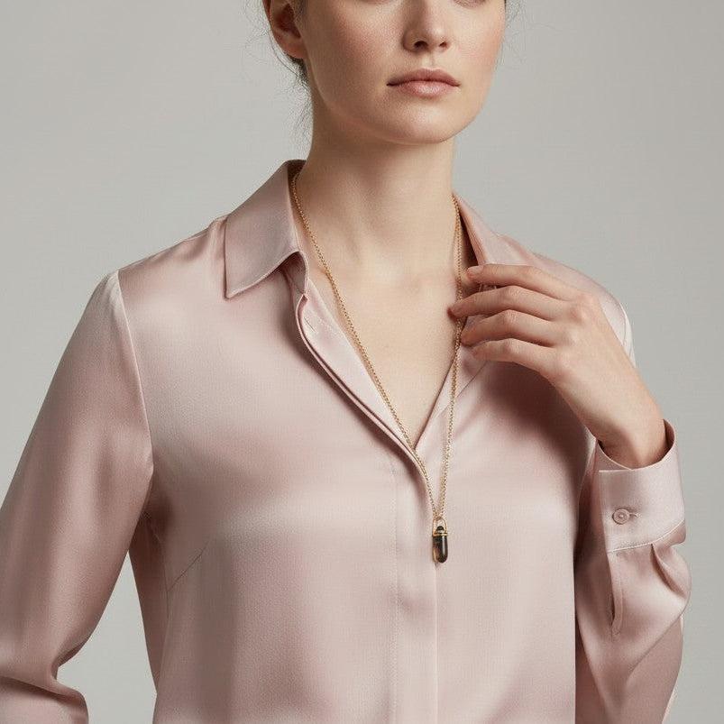 Mirabelle Jewellery smoky quartz pebble pendant in 22ct gold plated brass worn on a delicate chain by a model