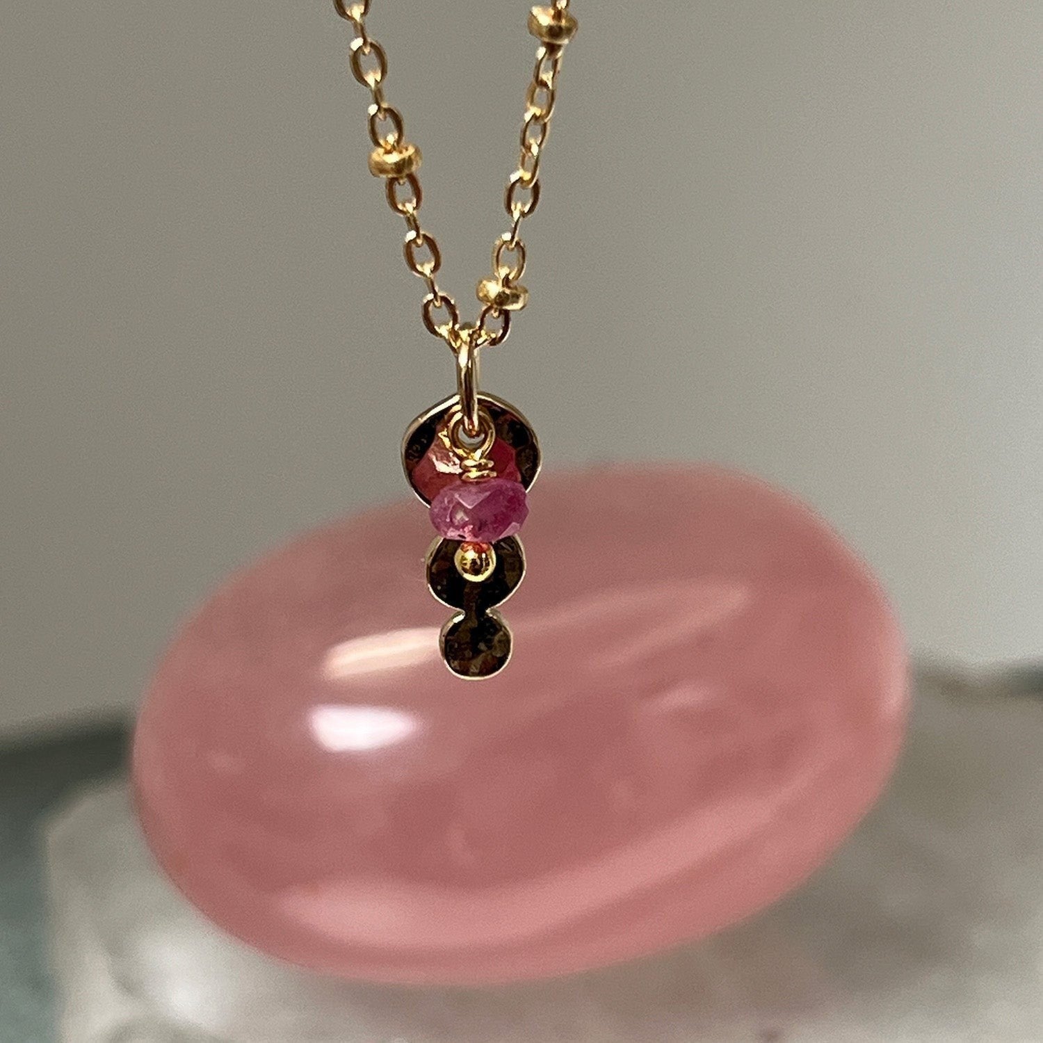 Mirabelle Jewellery gold-plated Trilogy pendant with a Burmese ruby on a delicate satellite chain.
