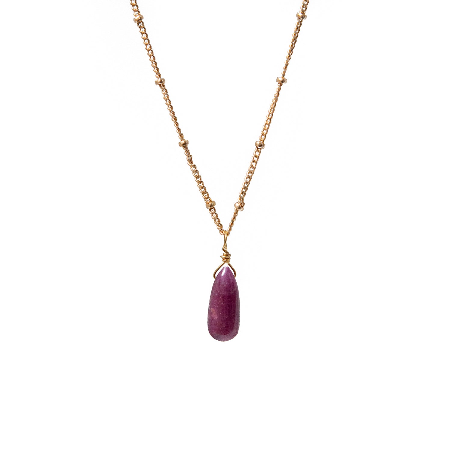 Necklace with a ruby teardrop pendant on a white background