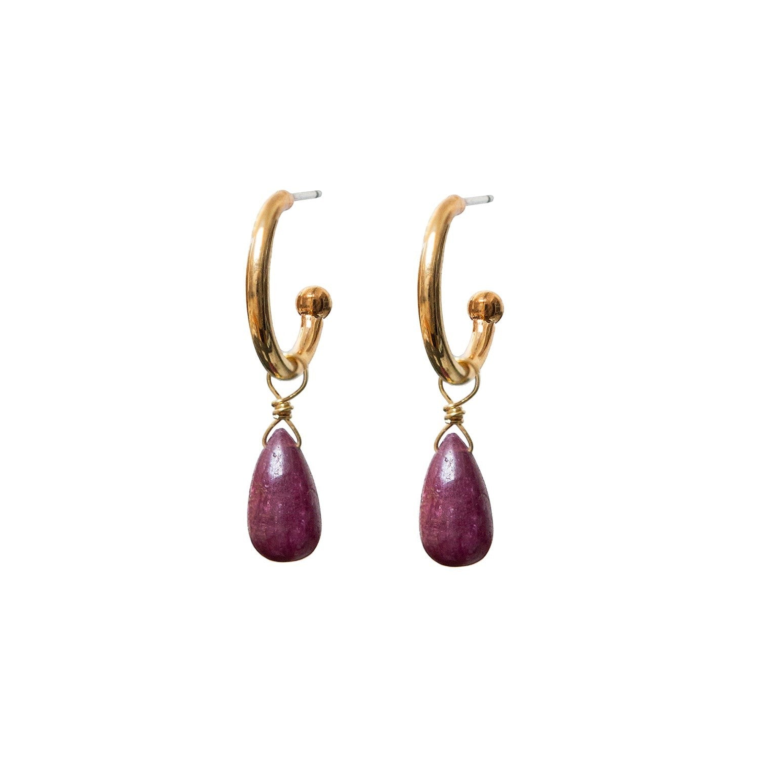Gold hoop earrings with teardrop-shaped ruby gemstones on a white background