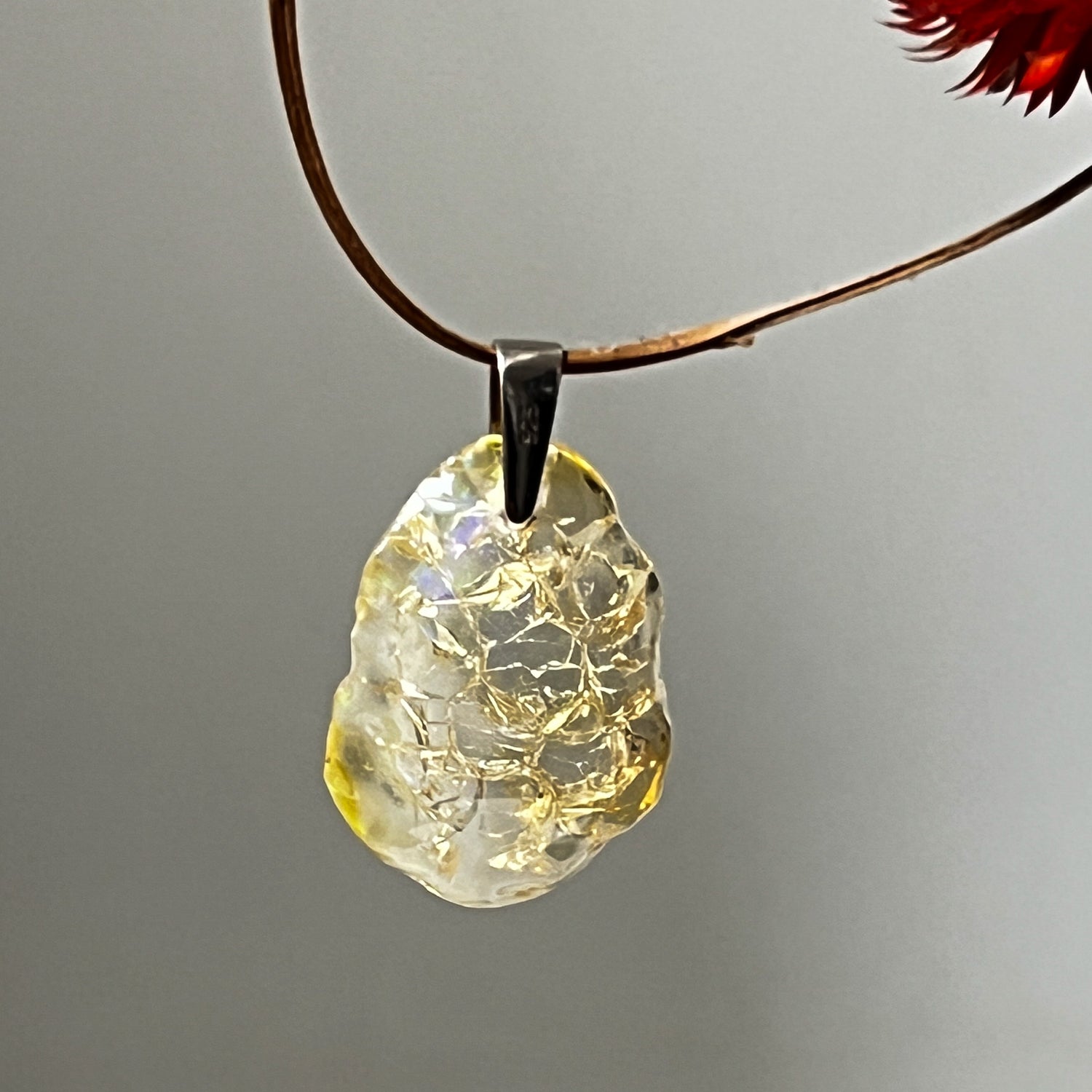Ethiopian fire opal pendant on a leather necklace