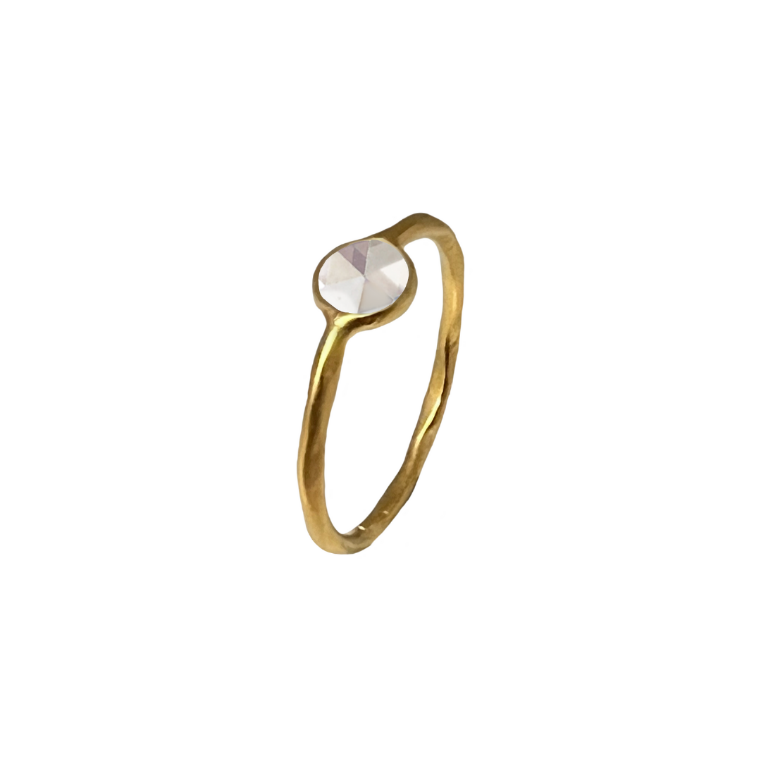 A gold-plated, vermeil-finished ring with a polki cut crystal centerpiece.