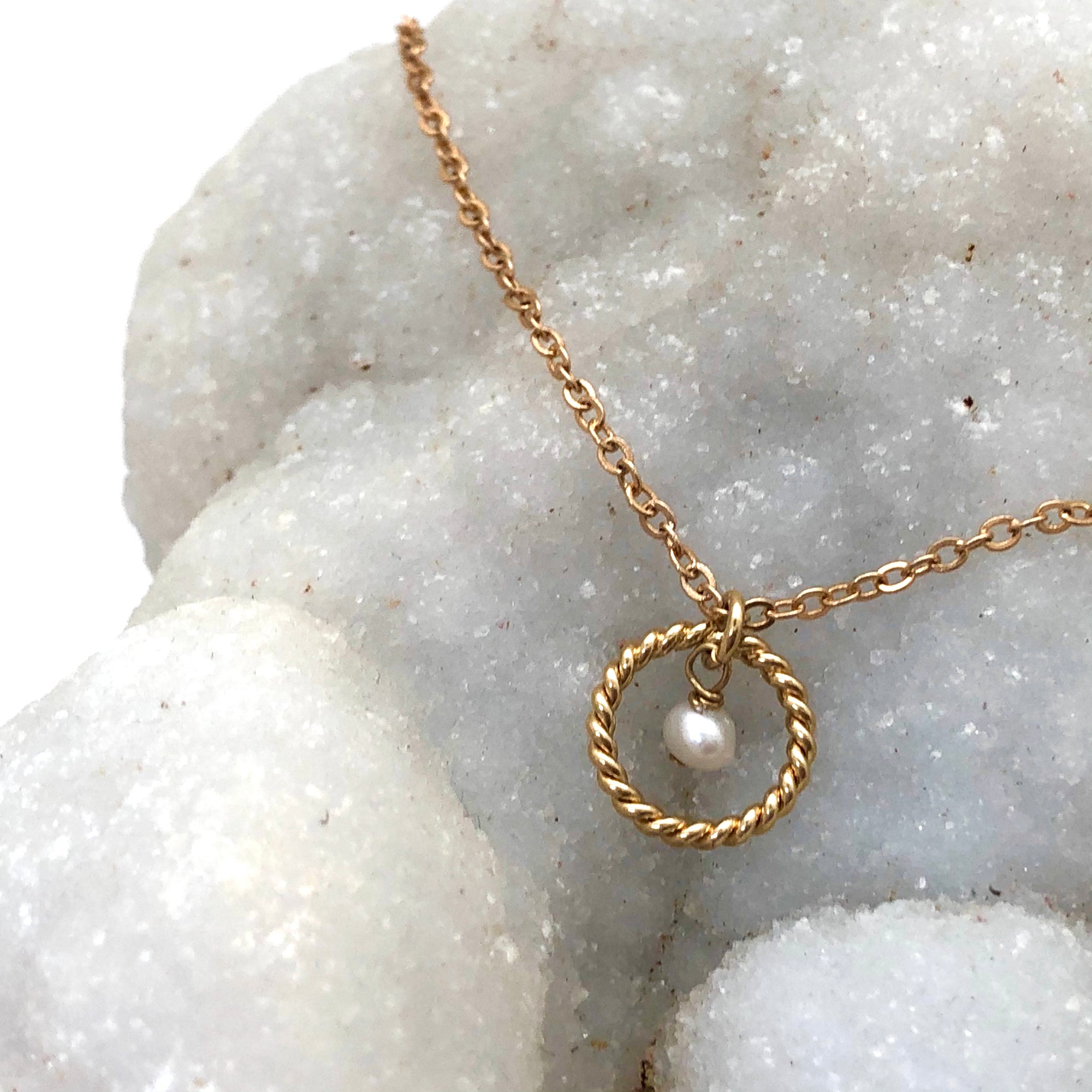 Alexis Freshwater Pearl Necklace displayed on a bed of crystals