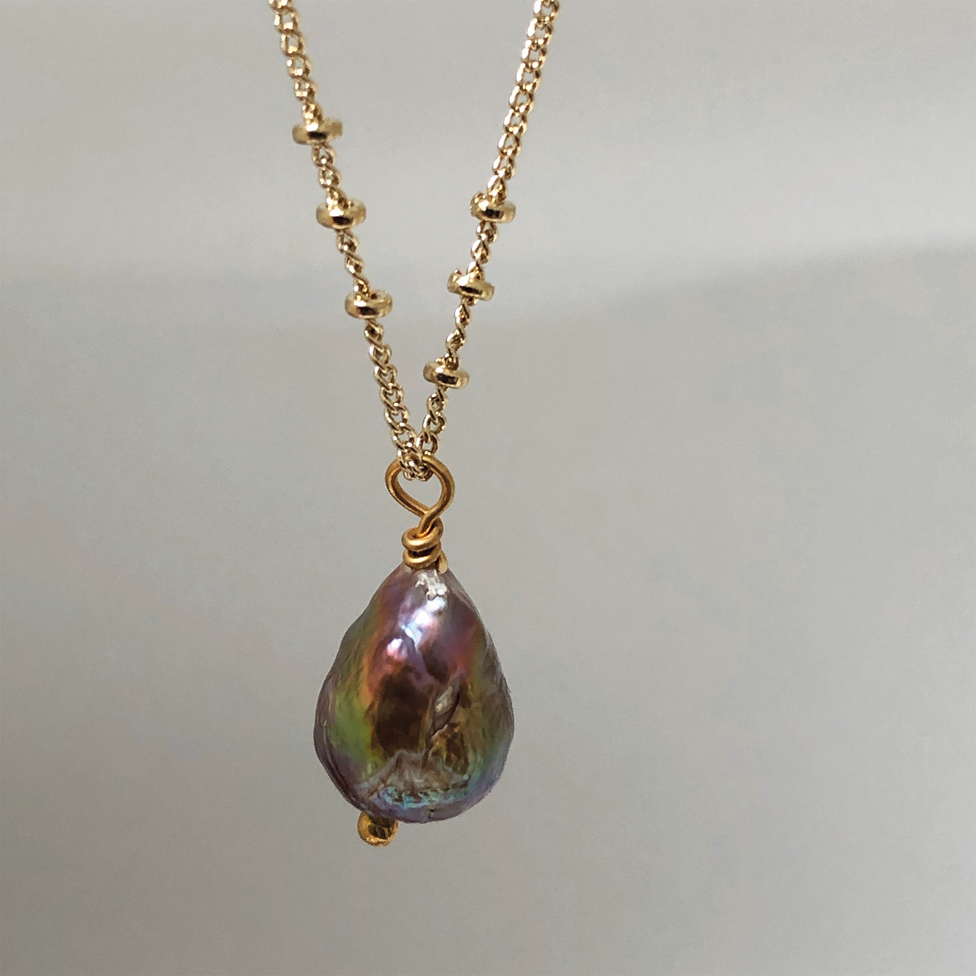 Cloes-up of a Baroque Pear Pearl on Mini Biba Gold-Plated Chain