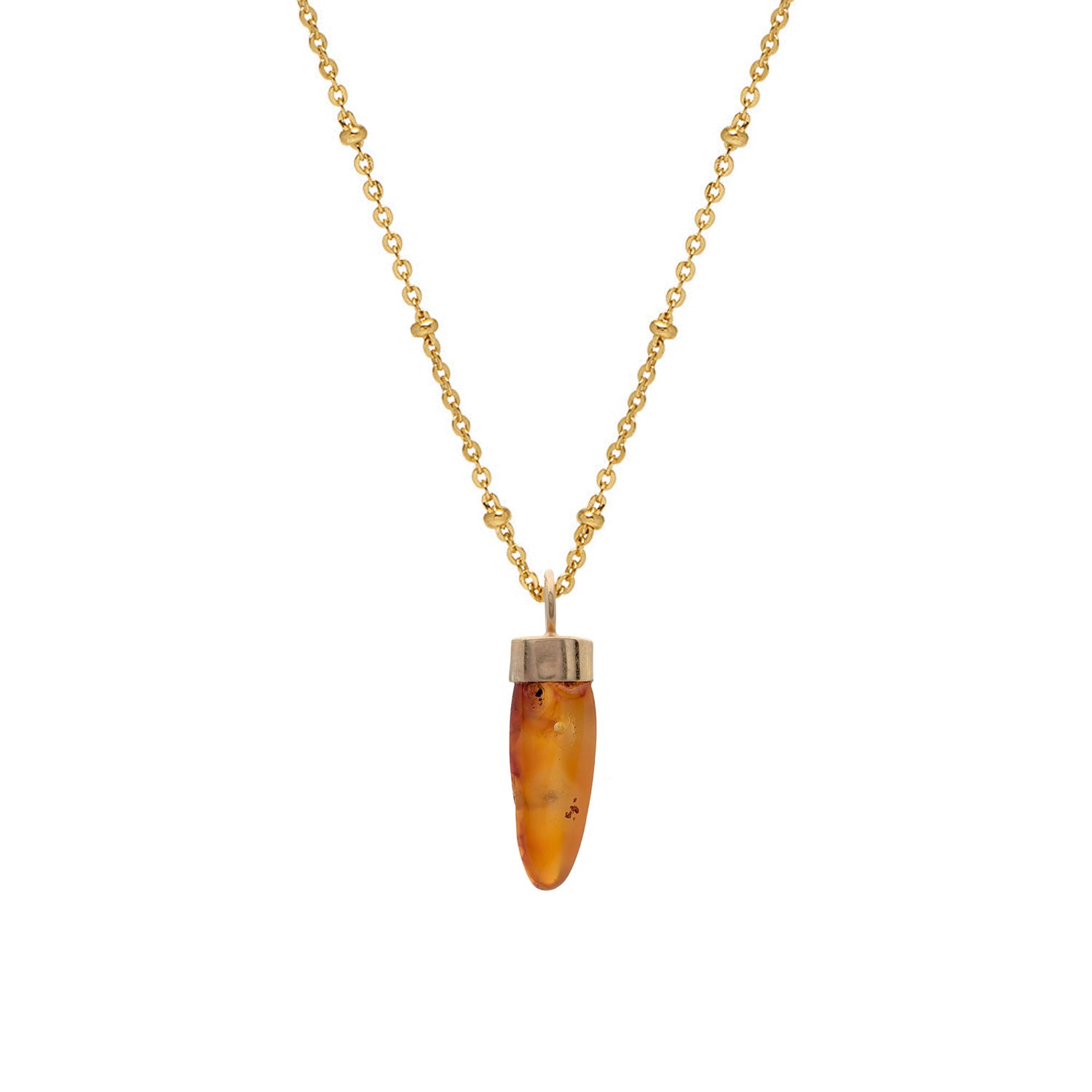 A gold-plated pendant with a carved orange Carnelian stone, attached to a long satellite chain.