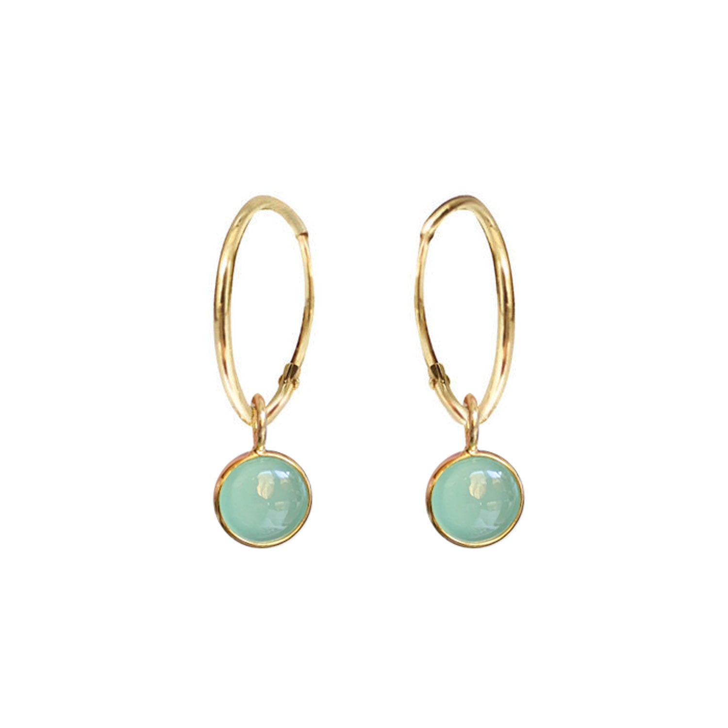 A pair of gold creole earrings with aqua chalcedony cabochons.