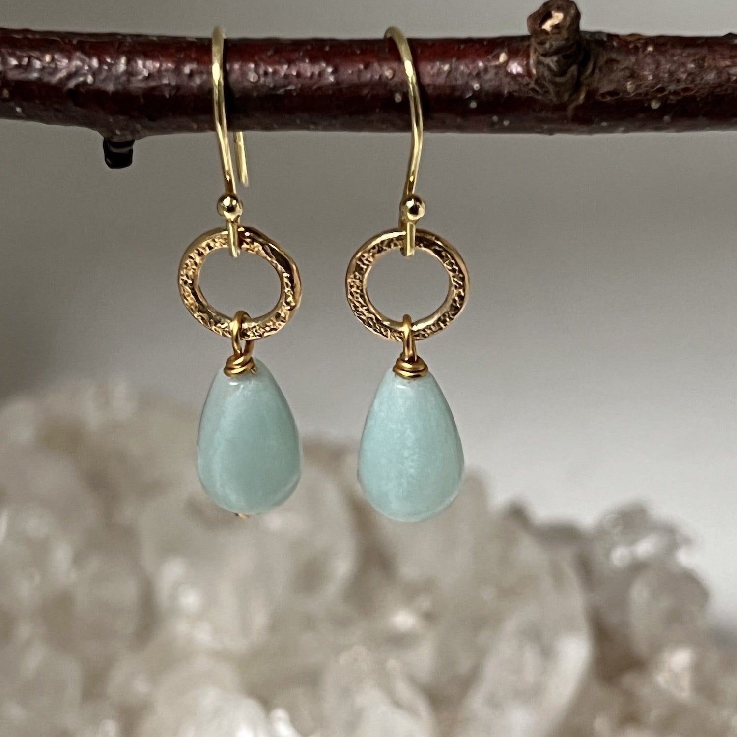 22ct gold plated earrings with calming amazonite stones hanging from a twig