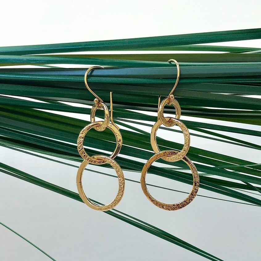 Gold Plated Lolita Loop Earrings on a leaf