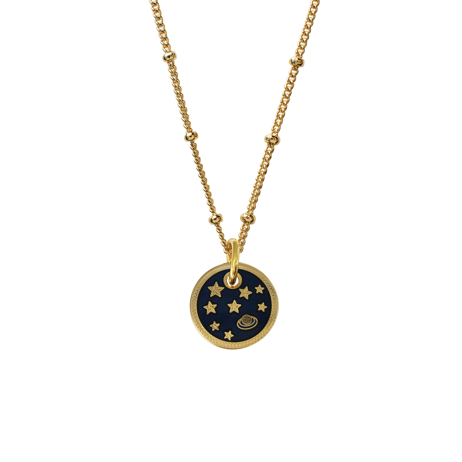 A gold-plated brass necklace with a circular enamel pendant featuring a planet and stars design on a dark background, attached to a 45cm gold-tone chain.