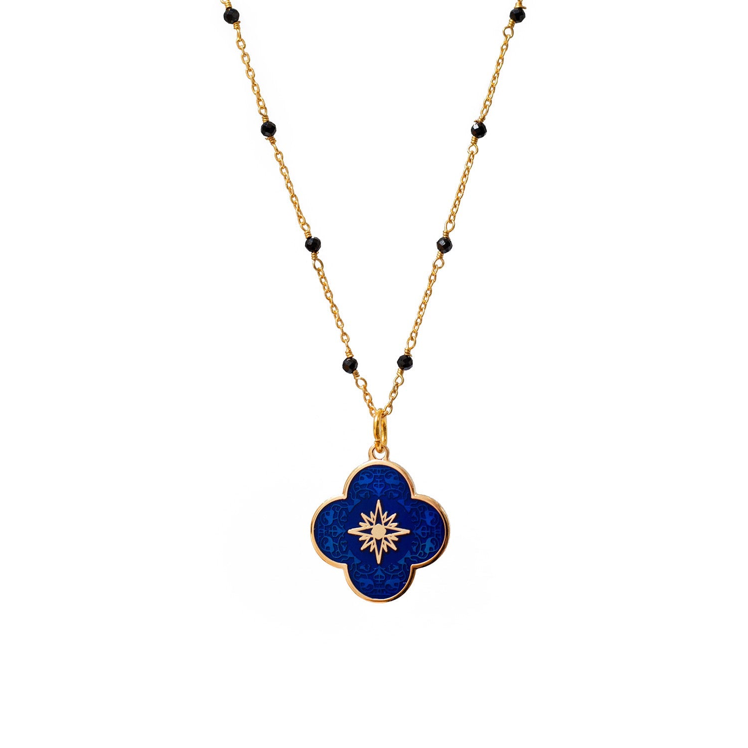 Gold-plated talisman jewellery necklace with blue enamel clover-shaped pendant and black bead chain detailing