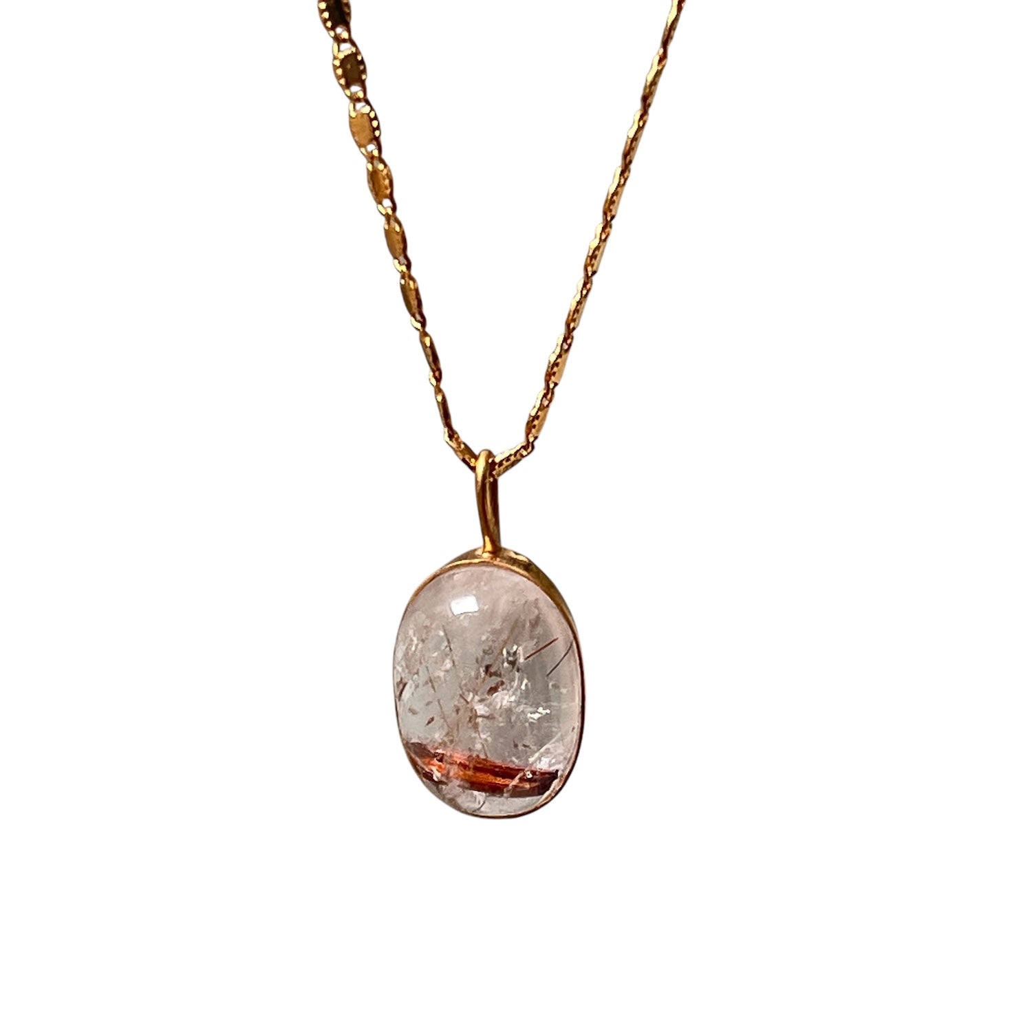 Gold necklace with oval rutilated quartz pendant showcasing fine needle-like inclusions in a clear crystal setting