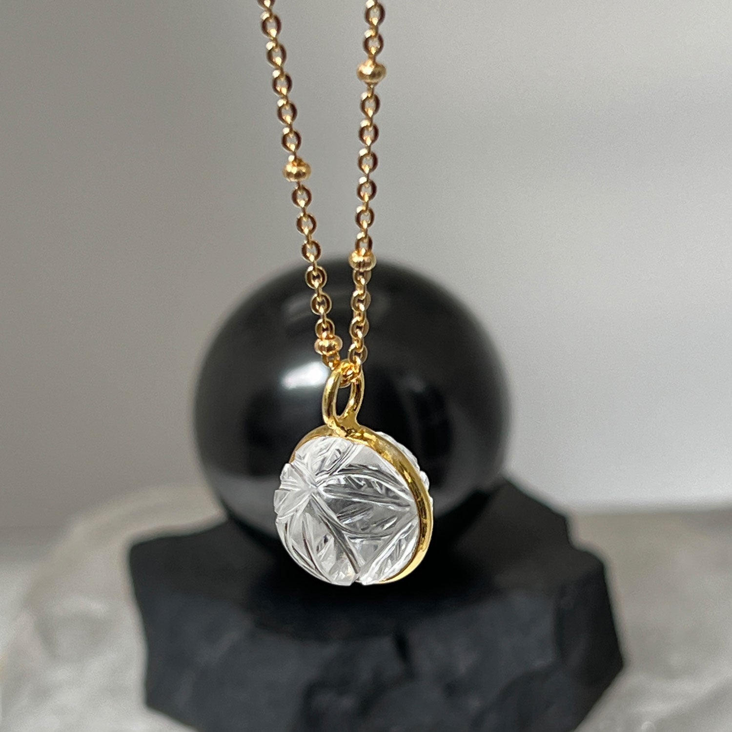 Carved Rock Crystal Ball Pendant on Long Satellite Chain