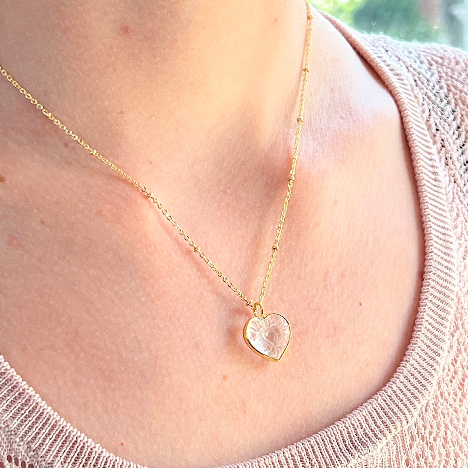 Carved rock Crystal Heart  pendant on short satellite chain