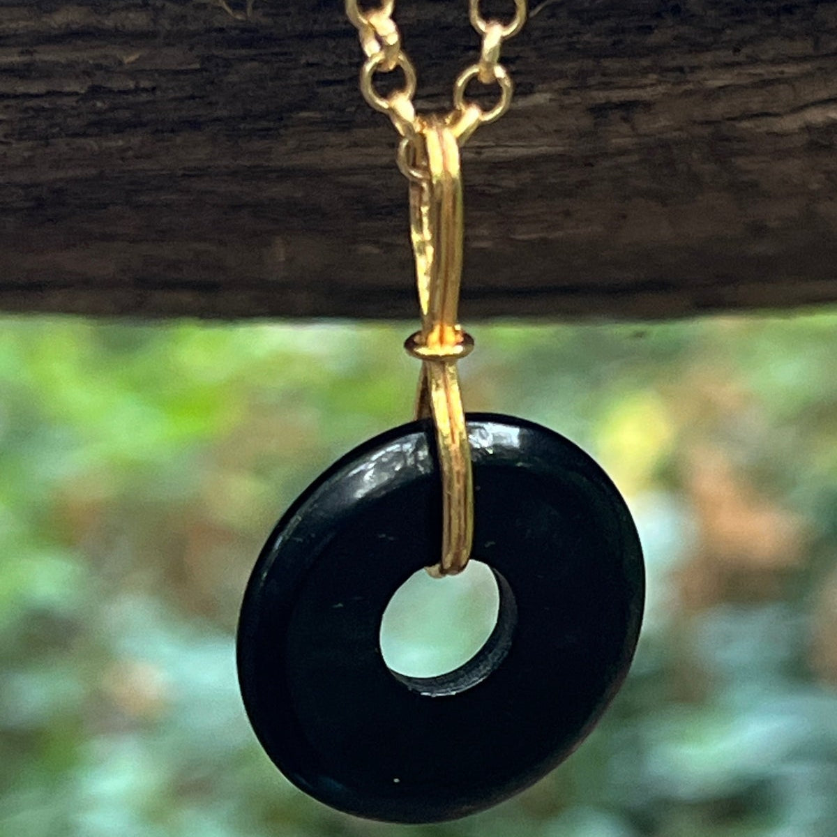 Grounding black onyx disc on short black onyx rosary or Belcher chain