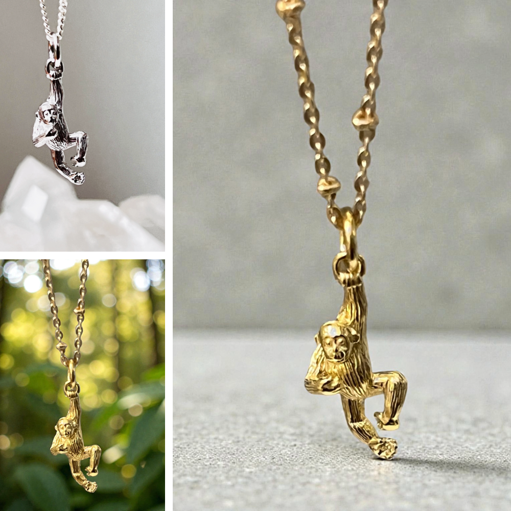 Collage of silver and gold monkey charms on a neutral background