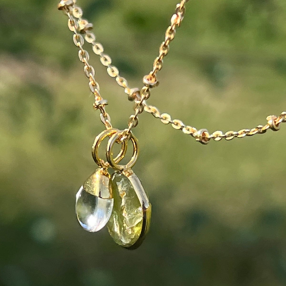 Freeform Raw Peridot slice with Smooth Rock Crystal Drop on Satellite chain