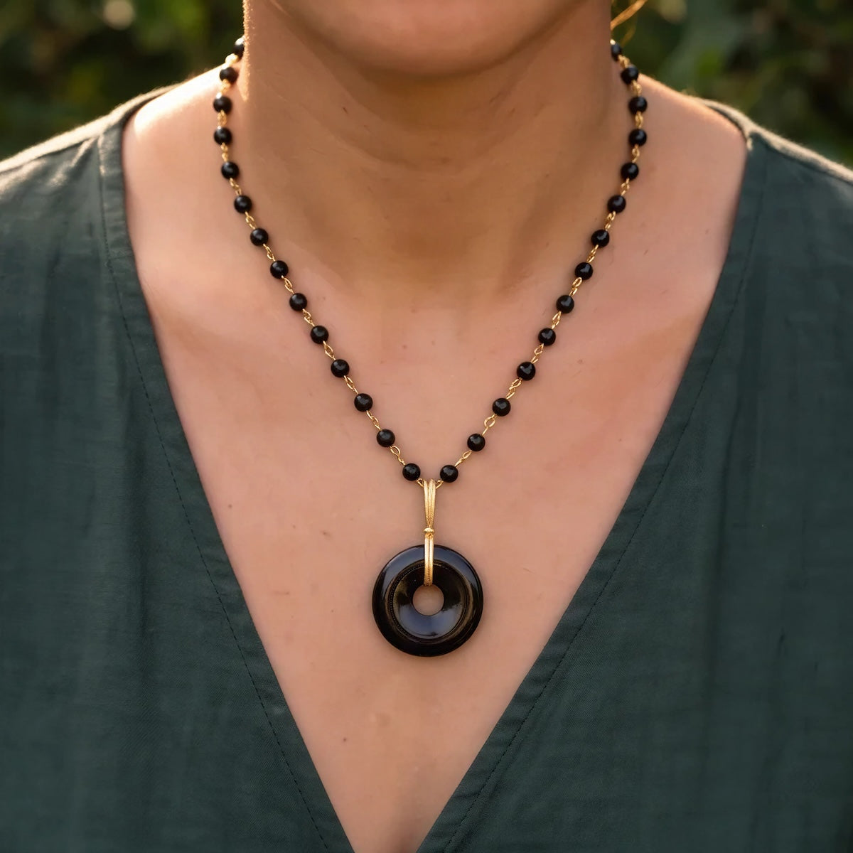 Grounding black onyx disc on short black onyx rosary or Belcher chain