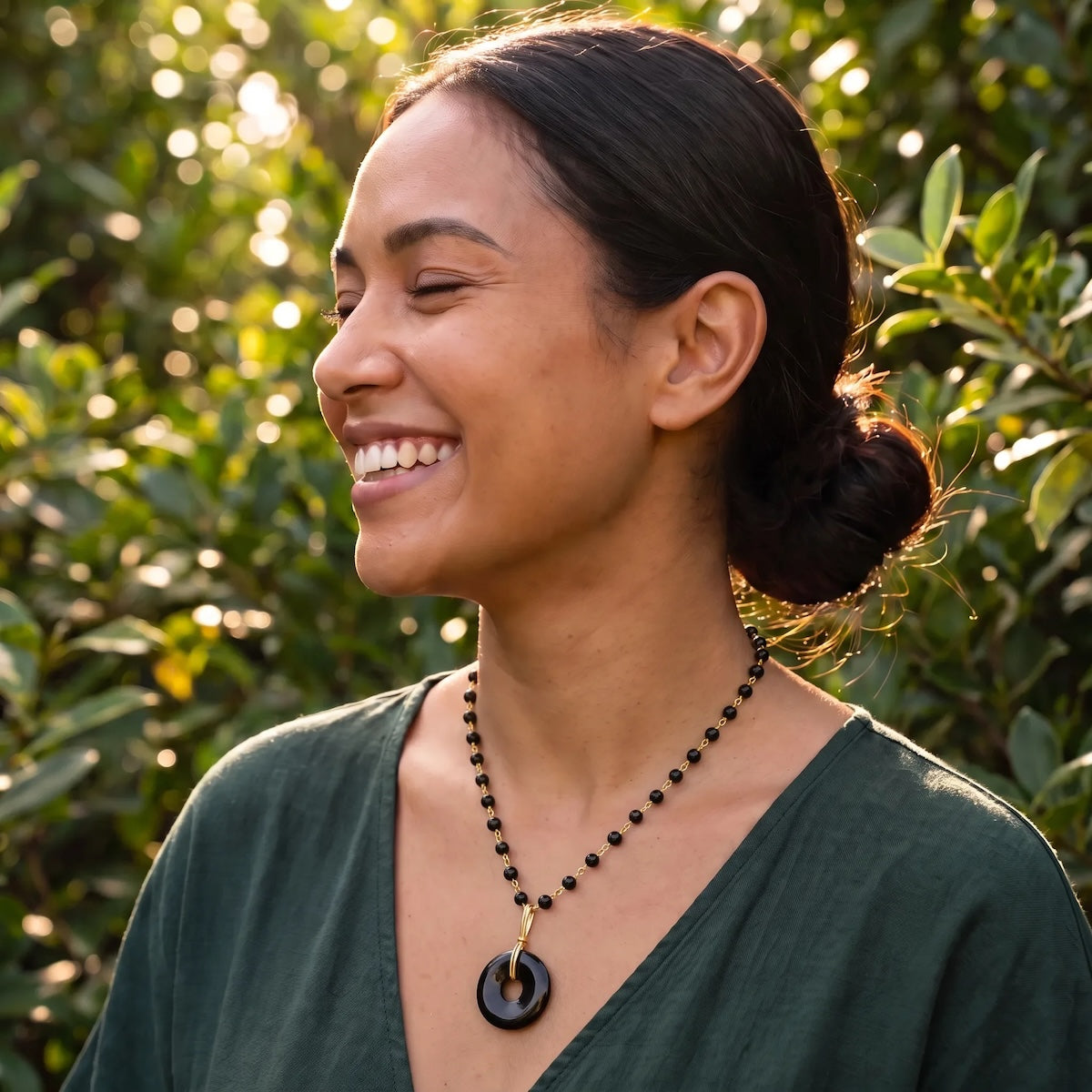 Grounding black onyx disc on short black onyx rosary or Belcher chain