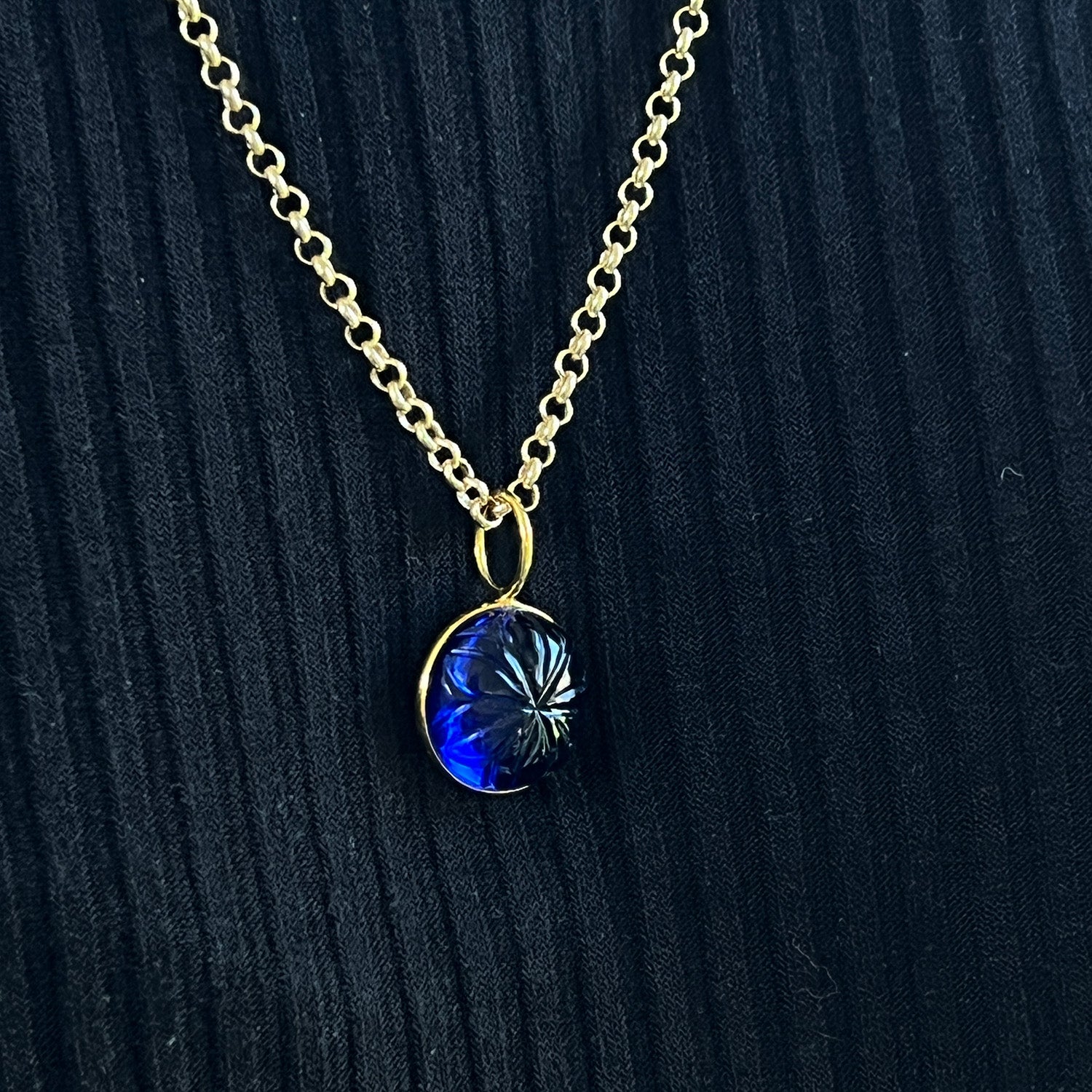 Carved Blue Glass Flower Pendant On Long Baby Belcher