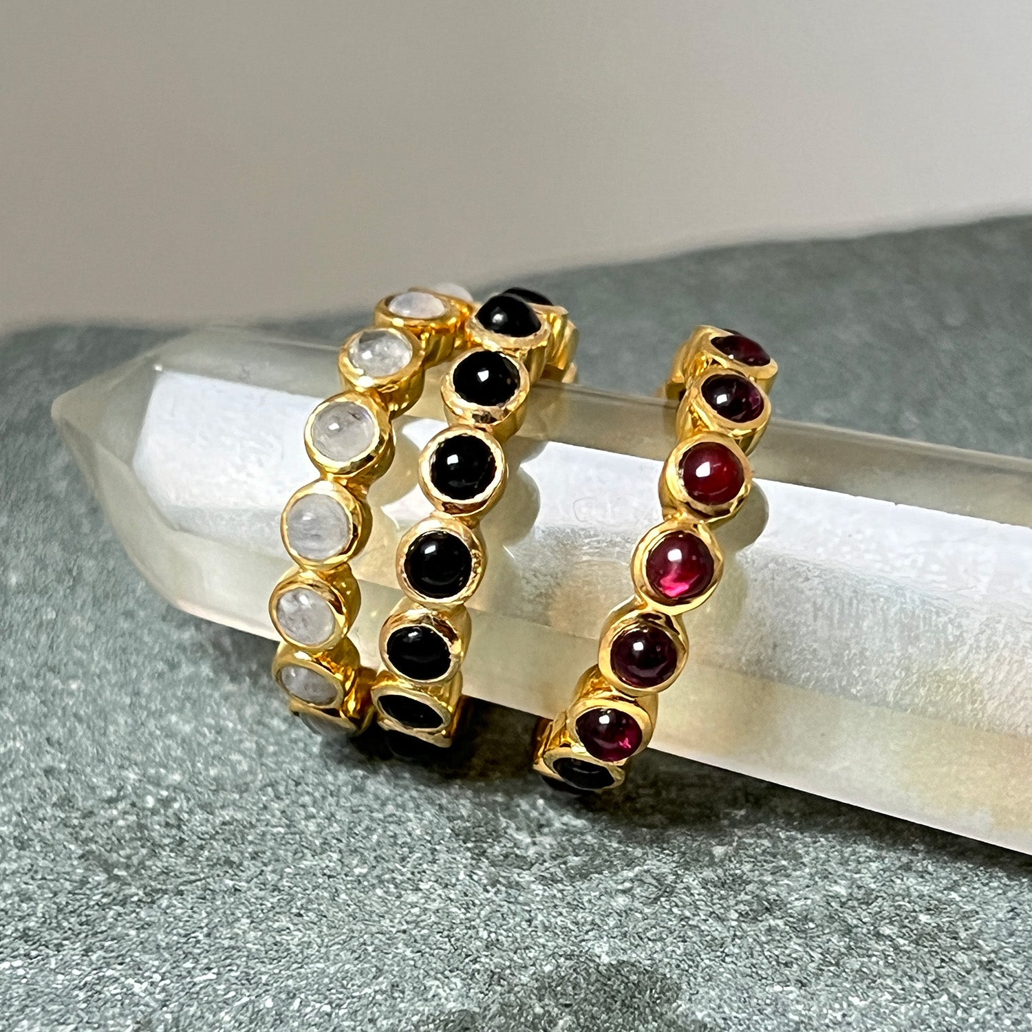 Theree different eternity rings in different colours