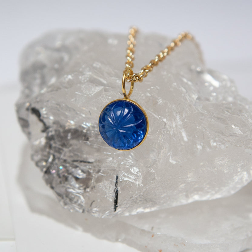 Carved Blue Glass Flower Pendant On Long Baby Belcher