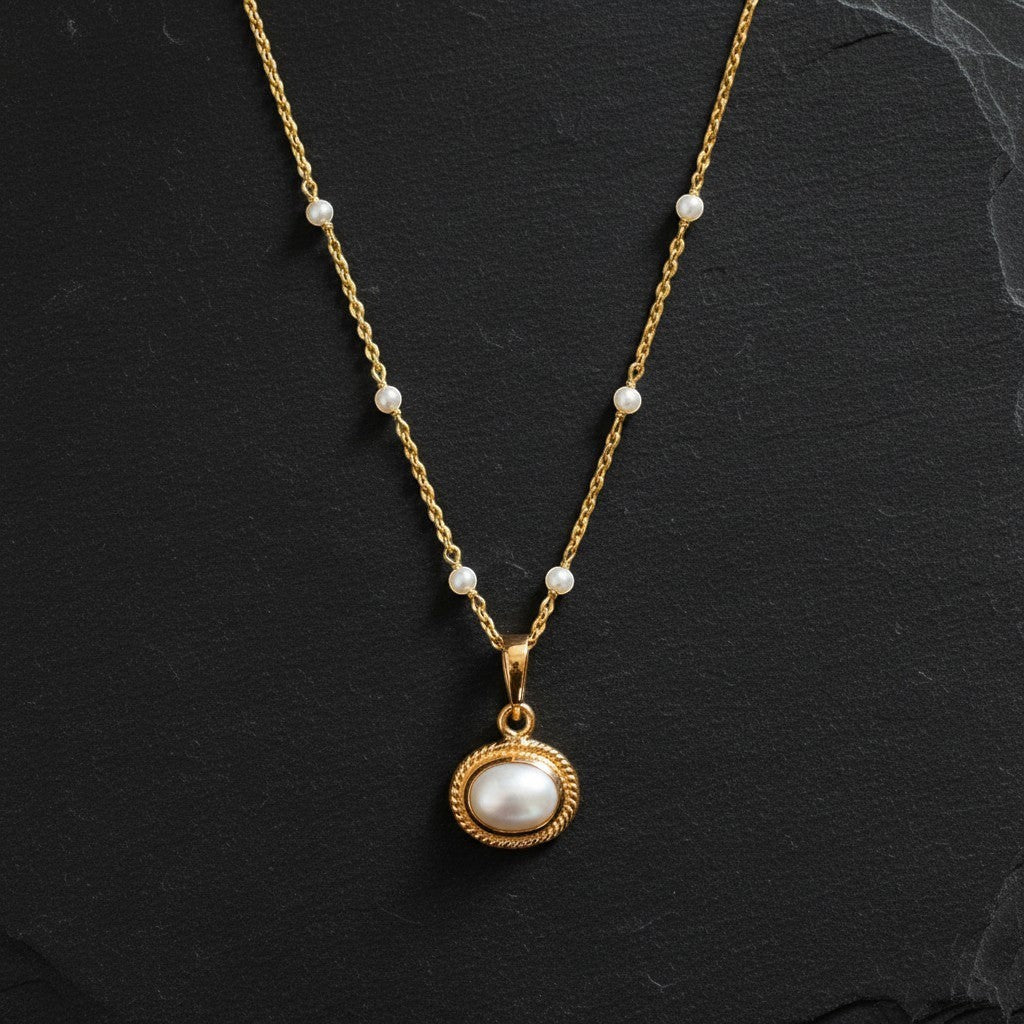 Mirabelle Jewellery Athena freshwater pearl pendant on a gold plated brass rosary chain with small pearl accents.