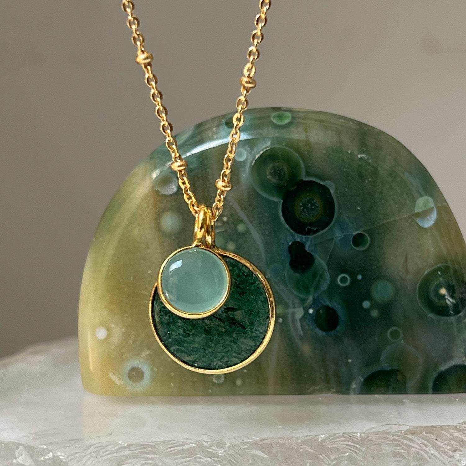 Mirabelle Jewellery Duo Jade & Aqua Chalcedony Pendant on a gold satellite chain. Features a large green jade and small aqua chalcedony stone.