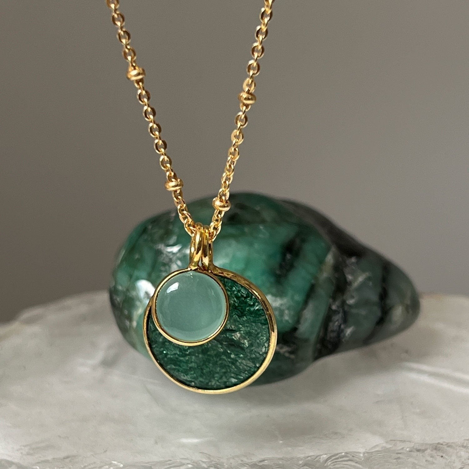Mirabelle Jewellery gold-plated brass pendant with jade and aqua chalcedony stones on a satellite chain.
